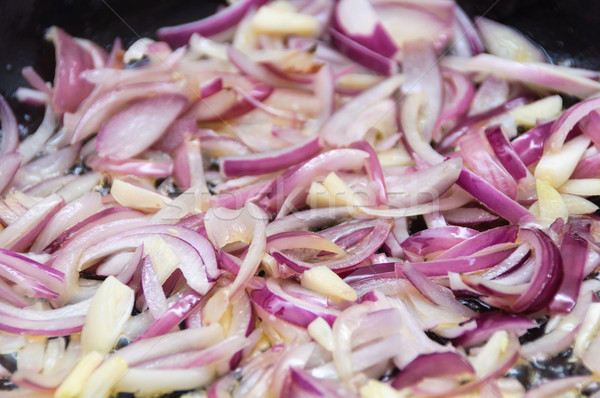 Cooking red onions and garlic Stock photo © dutourdumonde