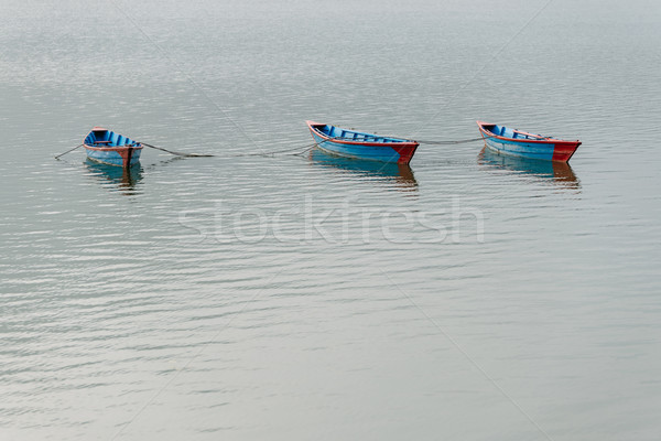 Three blue boats on Phewa Lake in Pokhara Stock photo © dutourdumonde