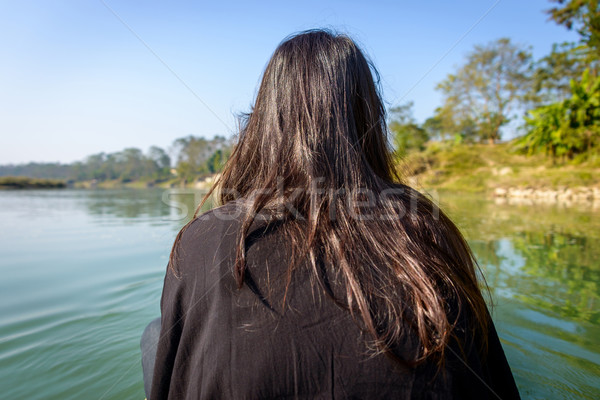 Stock photo: Woman on a pirogue