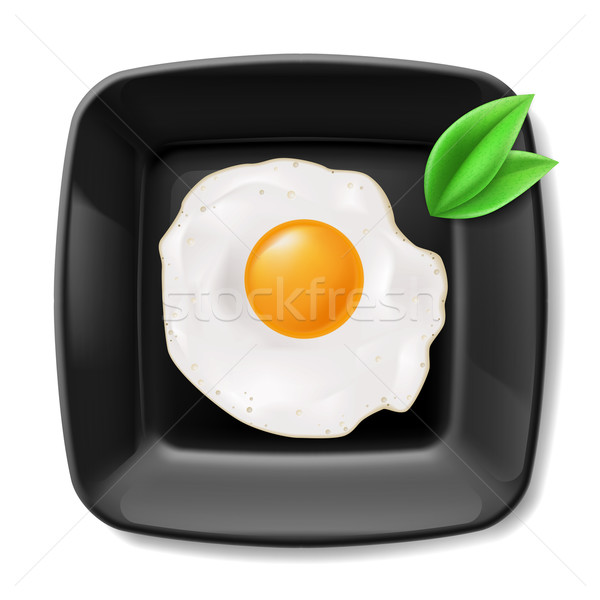 Stock photo: Fried eggs served on black plate