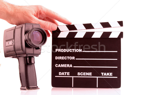 Clapboard, hand and camera Stock photo © dzejmsdin