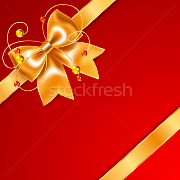 Golden bow of silk ribbon, isolated on red background Stock photo © Ecelop