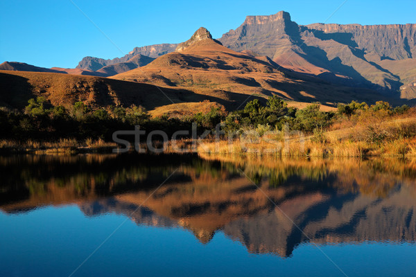 Arenisca montanas reflexión simétrico agua real Foto stock © EcoPic