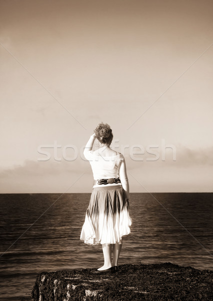 Dreamy woman looking at the sea Stock photo © Eireann