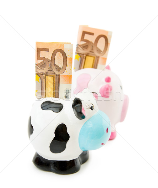 Piggy and Cowie money banks Stock photo © Eireann