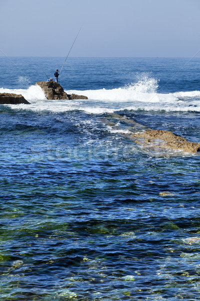 Fisherman Amongst the Waves Stock photo © eldadcarin