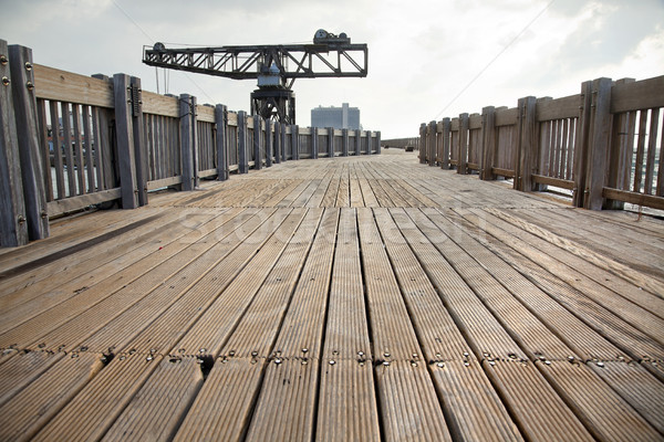Wooden Boardwalk & Vintage Crane Stock photo © eldadcarin