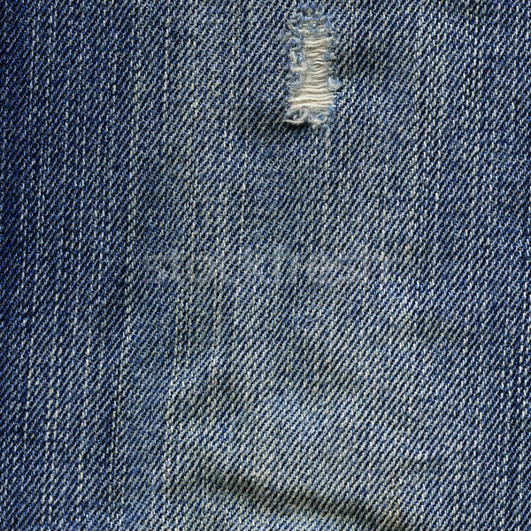 Denim Fabric Texture - Worn Out Blue Stock photo © eldadcarin