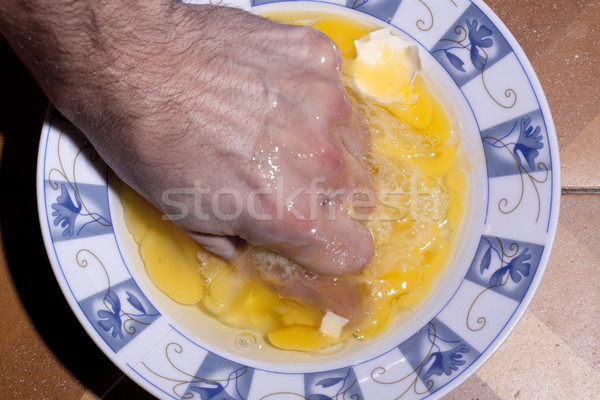 Kéz tojás tojássárgája kerámia tányér Stock fotó © eldadcarin