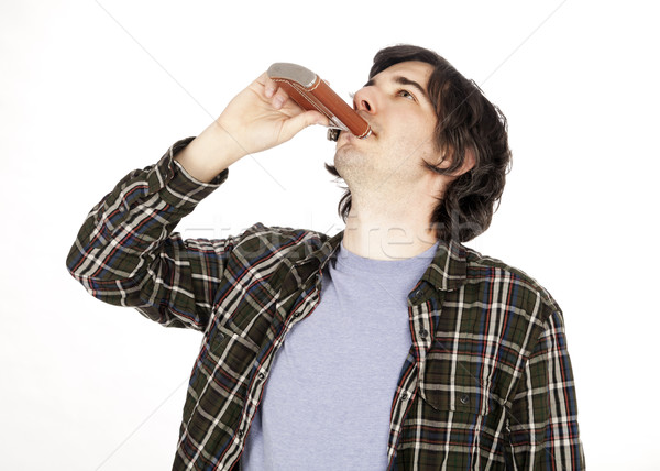 Casual 30's Guy Drinking from a Hip Flask Stock photo © eldadcarin