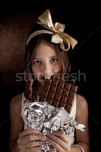 Ragazza cioccolato undici anni vecchio buio Foto d'archivio © Elegies