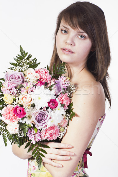 Fiatal nő virágcsokor mosolyog kaukázusi különböző virágok Stock fotó © Elegies