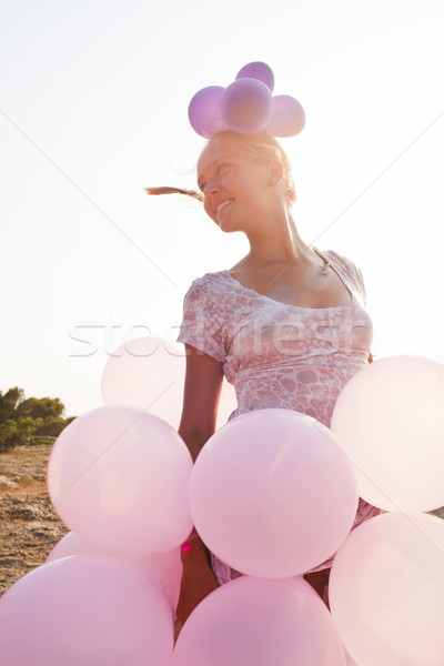 Lány léggömbök sugarak napfény fiatal nő színes Stock fotó © Elegies