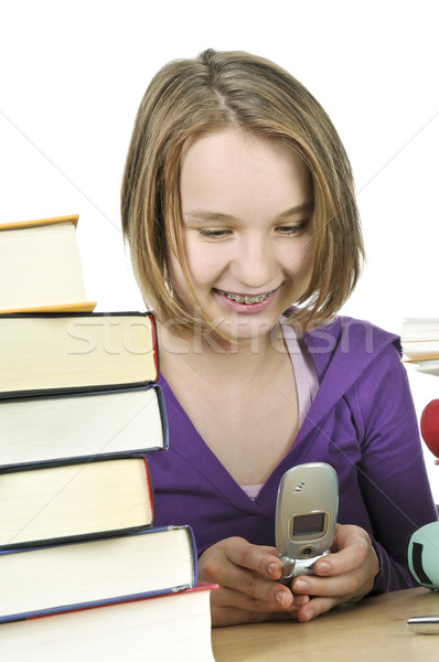 Tienermeisje studeren mobiele telefoon school meisje Stockfoto © elenaphoto