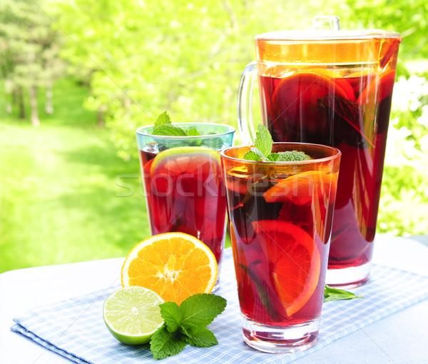 Fruit punch in pitcher and glasses Stock photo © elenaphoto