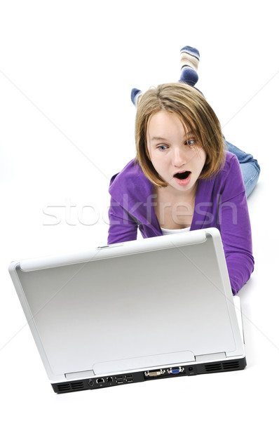 Menina computador surpreendido jovem computador portátil Foto stock © elenaphoto