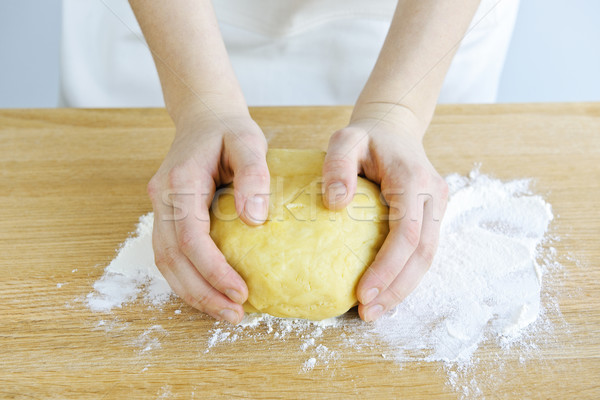 Hands kneading dough Stock photo © elenaphoto