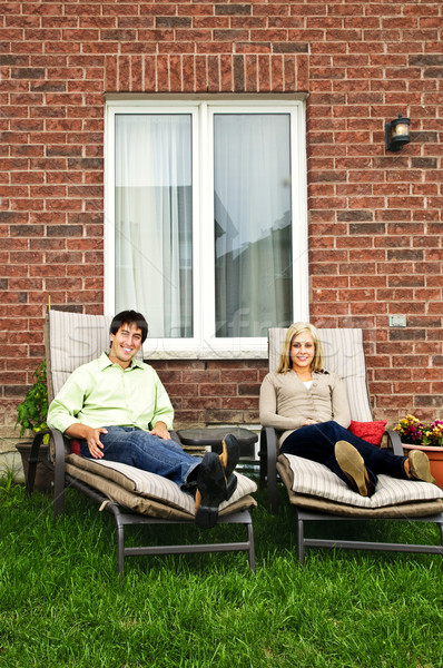 Stock photo: Happy couple relaxing at home
