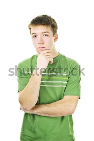 молодым человеком мышления Постоянный изолированный белый Сток-фото © elenaphoto
