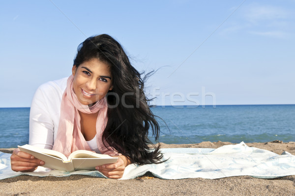 Young native american woman reading Stock photo © elenaphoto