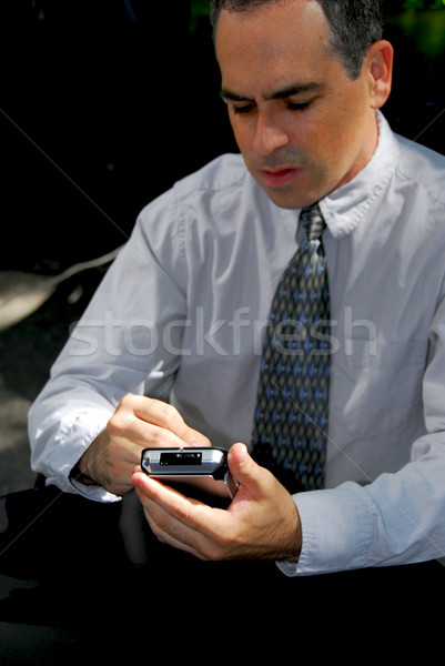 Biznesmen pda ręce strony twarz człowiek Zdjęcia stock © elenaphoto