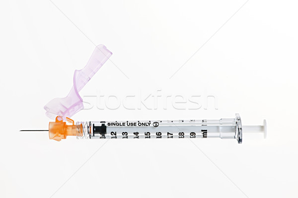 Syringe over white Stock photo © elenaphoto