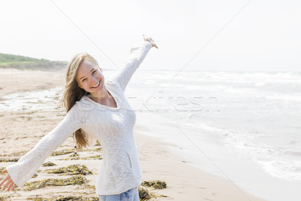 Genç kadın mutlu plaj genç kaygısız Stok fotoğraf © elenaphoto