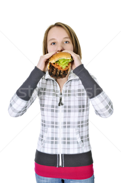 [[stock_photo]]: Adolescente · manger · grand · hamburger · isolé · blanche