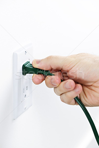 Main plug vert électrique énergie Photo stock © elenaphoto