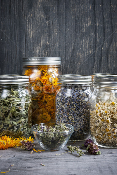 Herbs in jars Stock photo © elenaphoto