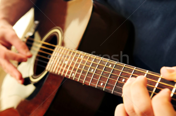 Man playing a guitar Stock photo © elenaphoto