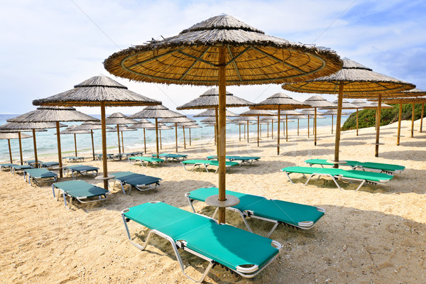 Stock photo: Beach umbrellas on sandy seashore