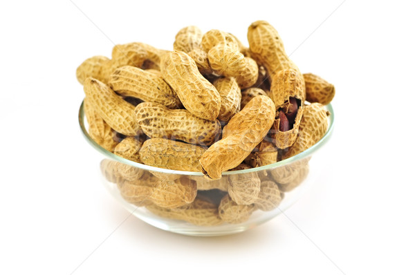 Amendoins tigela conchas comida fundo Foto stock © elenaphoto