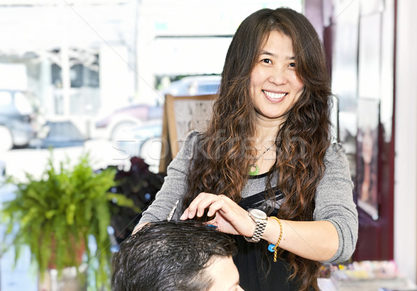 Hairstylist working Stock photo © elenaphoto