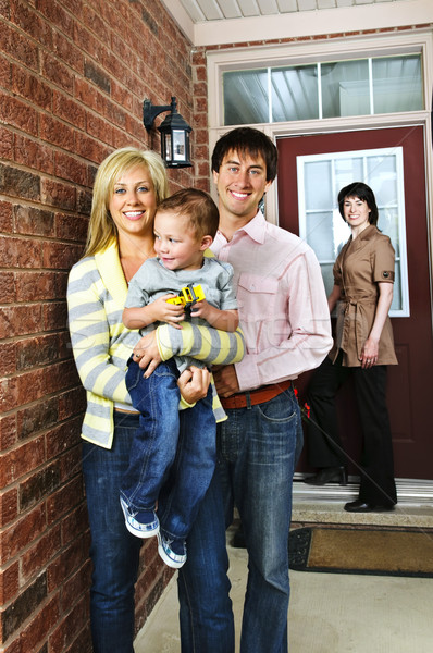 Happy family with real estate agent Stock photo © elenaphoto