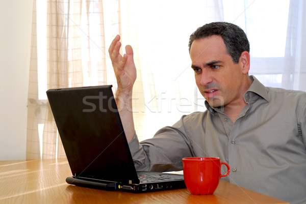 Man with laptop Stock photo © elenaphoto