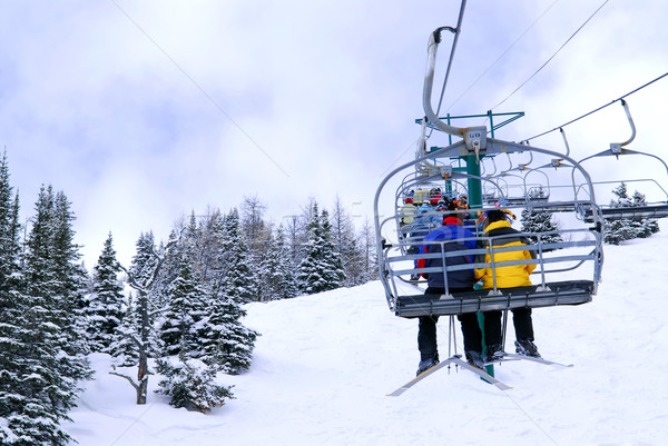 Skiers on chairlift Stock photo © elenaphoto