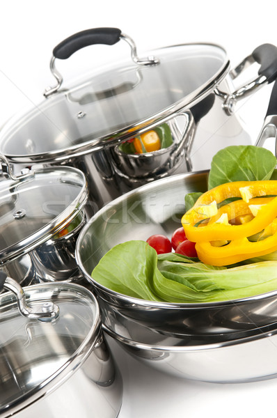 Stock photo: Stainless steel pots and pans with vegetables