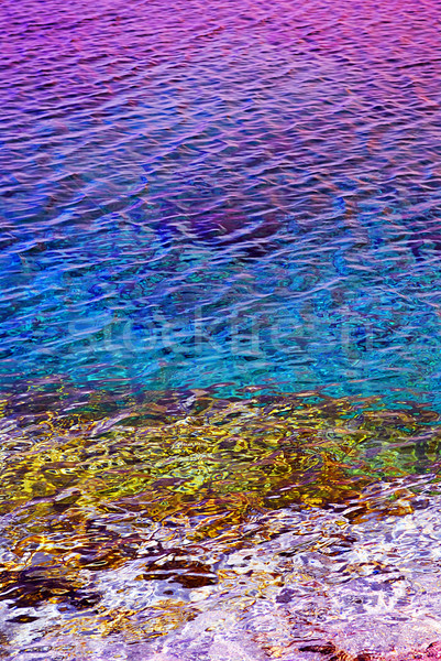 Su yüzeyi doğal renkli gün batımı yansıma kayalar Stok fotoğraf © elenaphoto