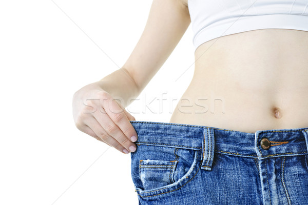 Stock photo: Woman showing weight loss