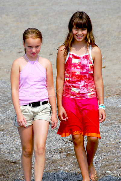 Two girls walking Stock photo © elenaphoto