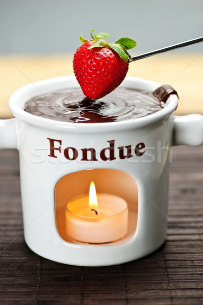 Strawberry dipped in chocolate fondue Stock photo © elenaphoto