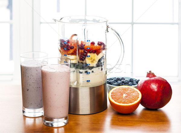 Making smoothies in blender with fruit and yogurt Stock photo © elenaphoto