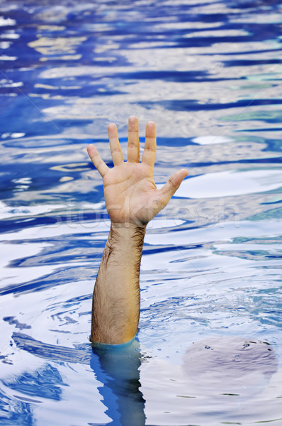 Hand of drowning man Stock photo © elenaphoto