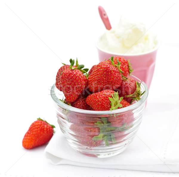 Bowl of strawberries with whipped cream Stock photo © elenaphoto