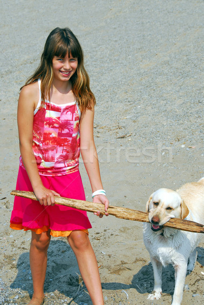Girl play dog Stock photo © elenaphoto