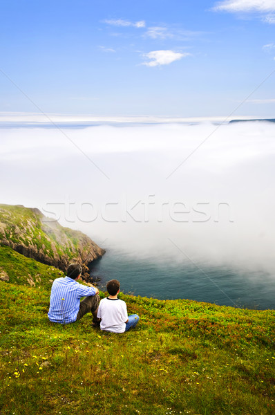 Father and son at ocean coast Stock photo © elenaphoto
