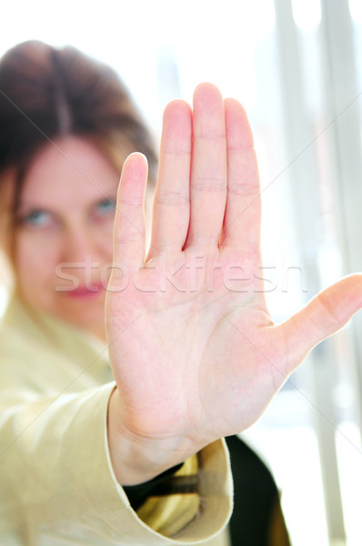 Mature woman gesturing stop Stock photo © elenaphoto