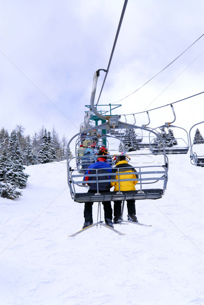 Skiers on chairlift Stock photo © elenaphoto