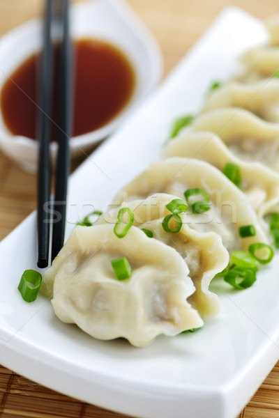 Steamed dumplings and soy sauce Stock photo © elenaphoto